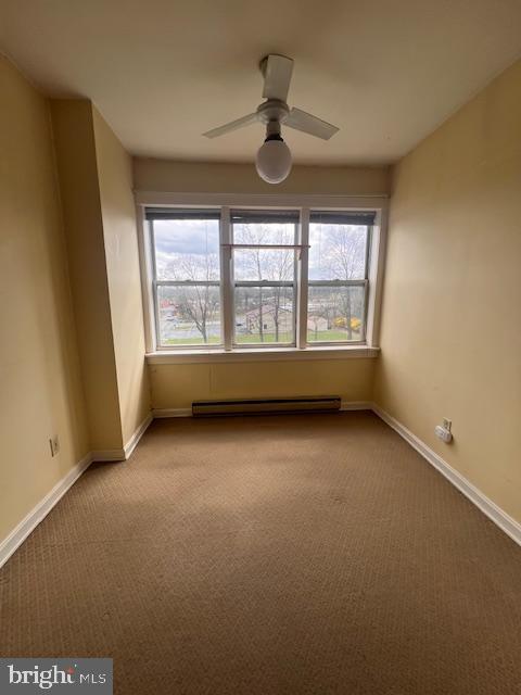 1200 West Church Road Mechanicsburg, PA 17050 - Photo 5 of 7 an empty room with windows and ceiling fan
