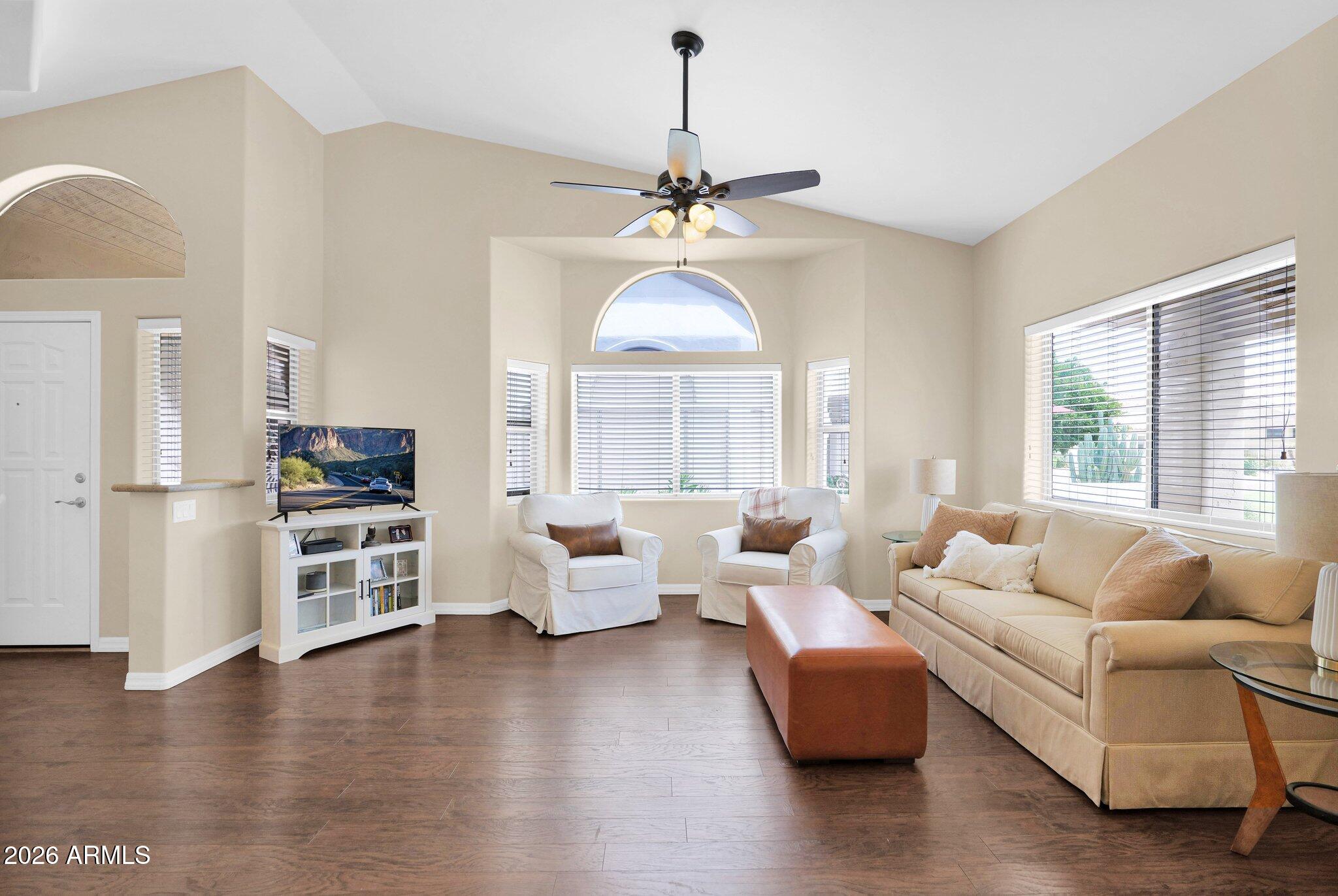 5830 East McKellips Road, Unit 110 Mesa, AZ 85215 - Photo 11 of 45 a living room with furniture wooden floor and a chandelier