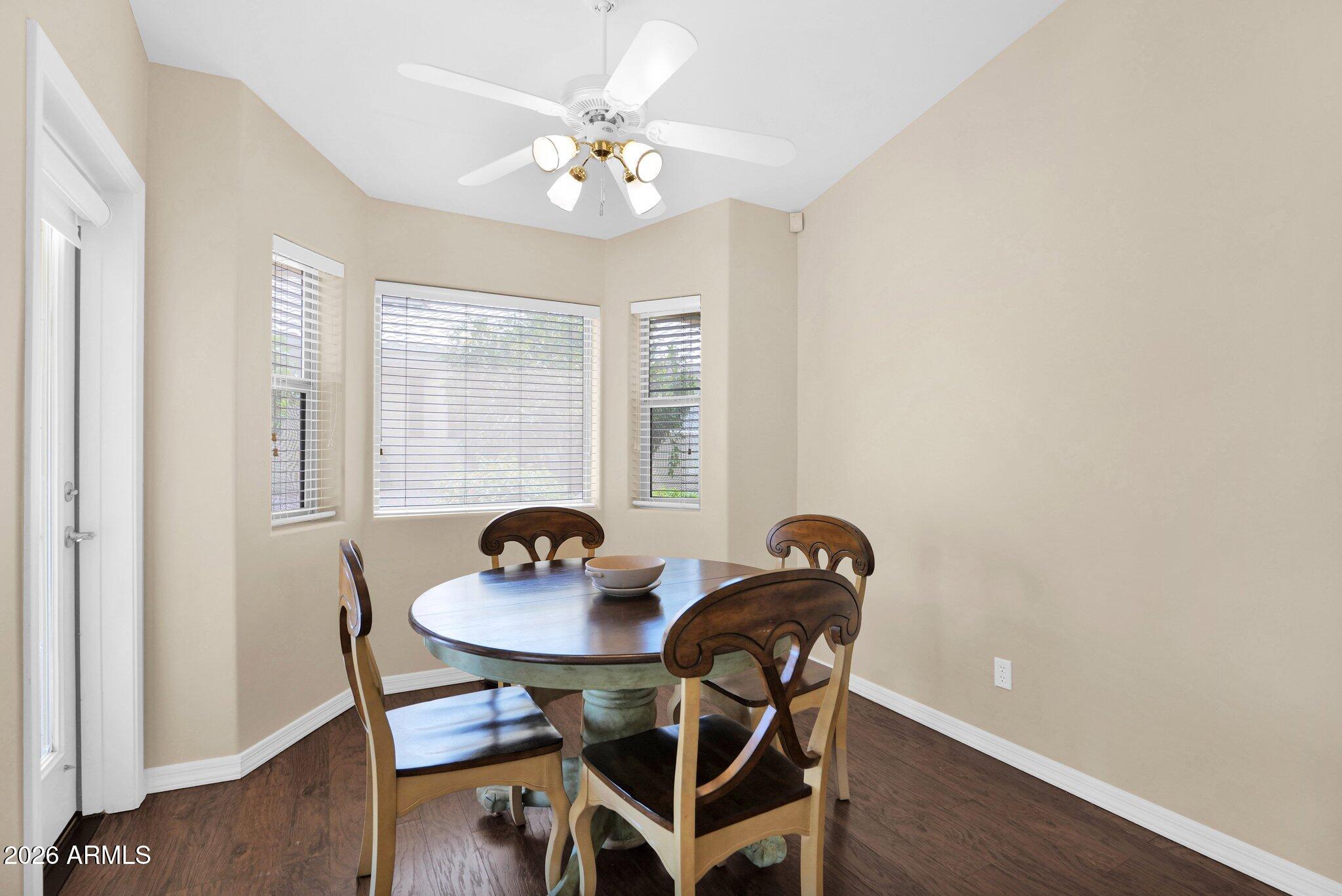 5830 East McKellips Road, Unit 110 Mesa, AZ 85215 - Photo 19 of 45 a dining room with furniture and window
