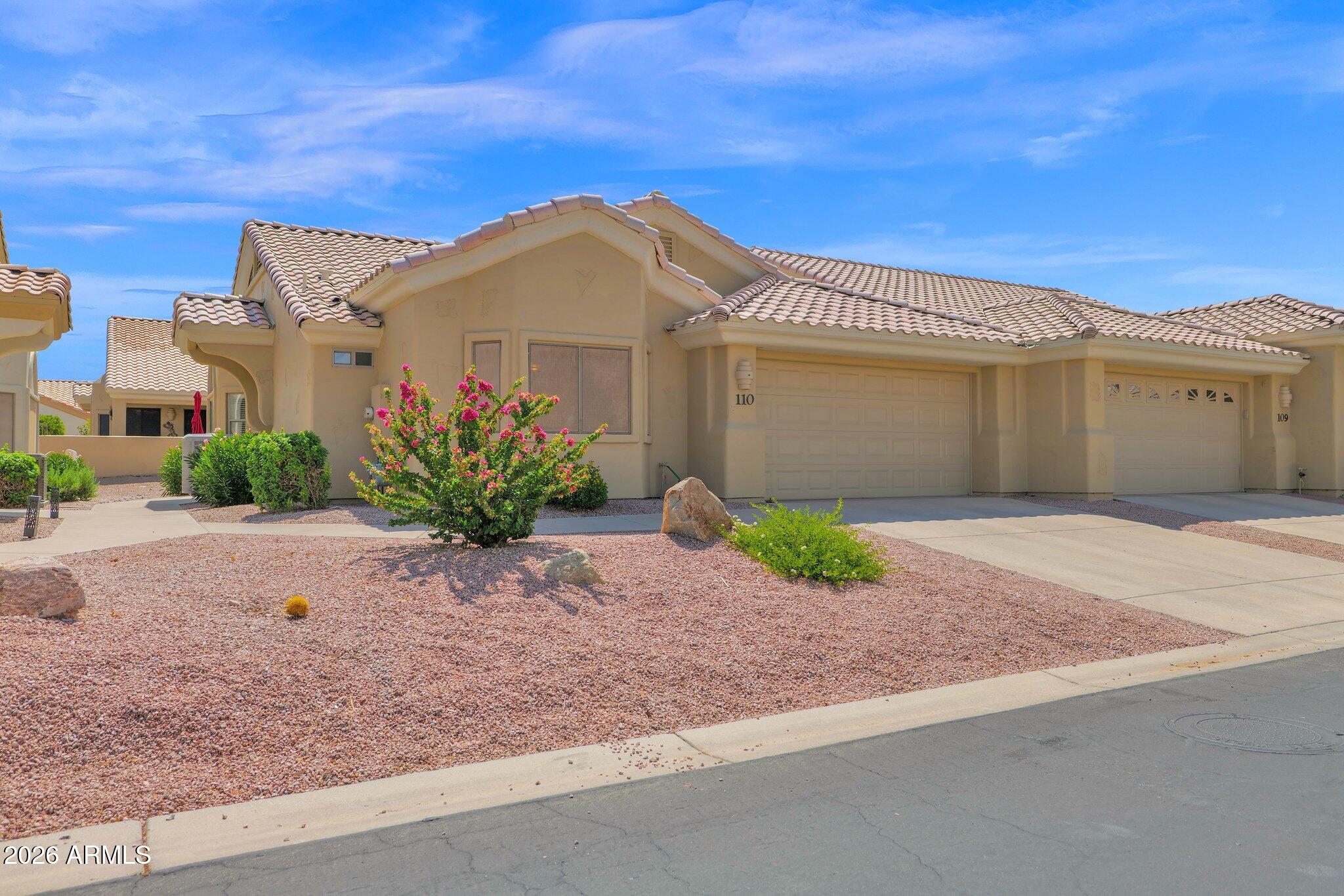 5830 East McKellips Road, Unit 110 Mesa, AZ 85215 - Photo 2 of 45 a view of a house with a garden