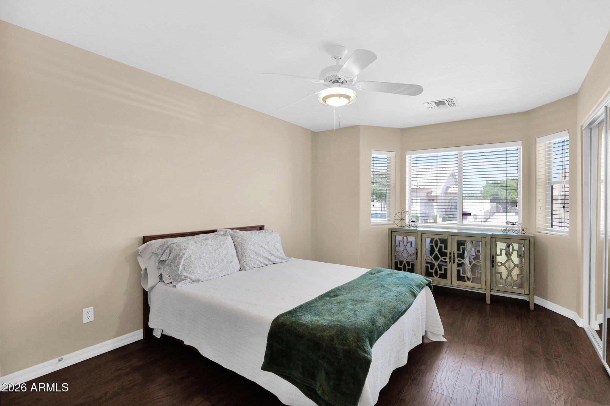 5830 East McKellips Road, Unit 110 Mesa, AZ 85215 - Photo 27 of 45 a bedroom with a bed and a table