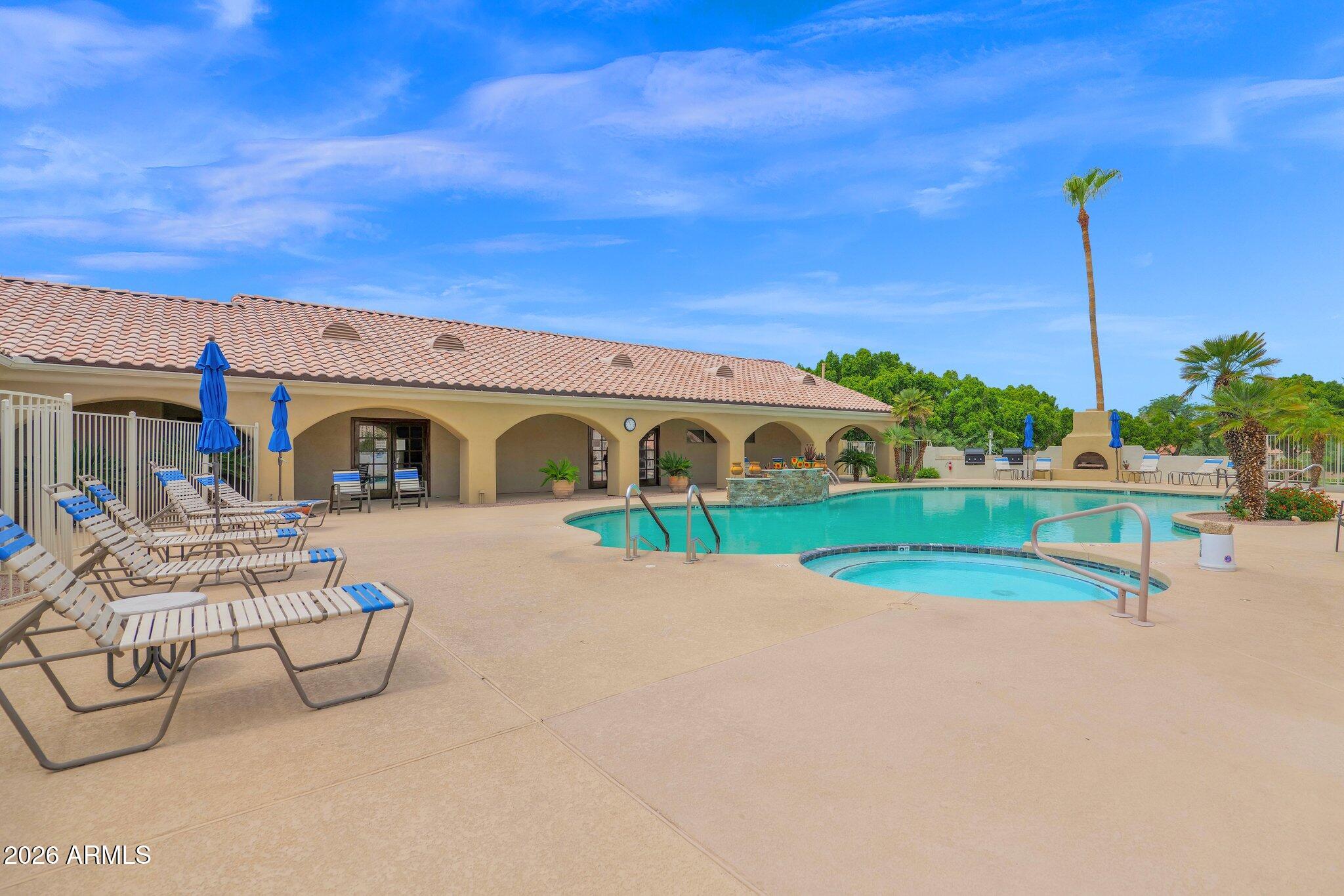 5830 East McKellips Road, Unit 110 Mesa, AZ 85215 - Photo 39 of 45 a front view of a house with garden