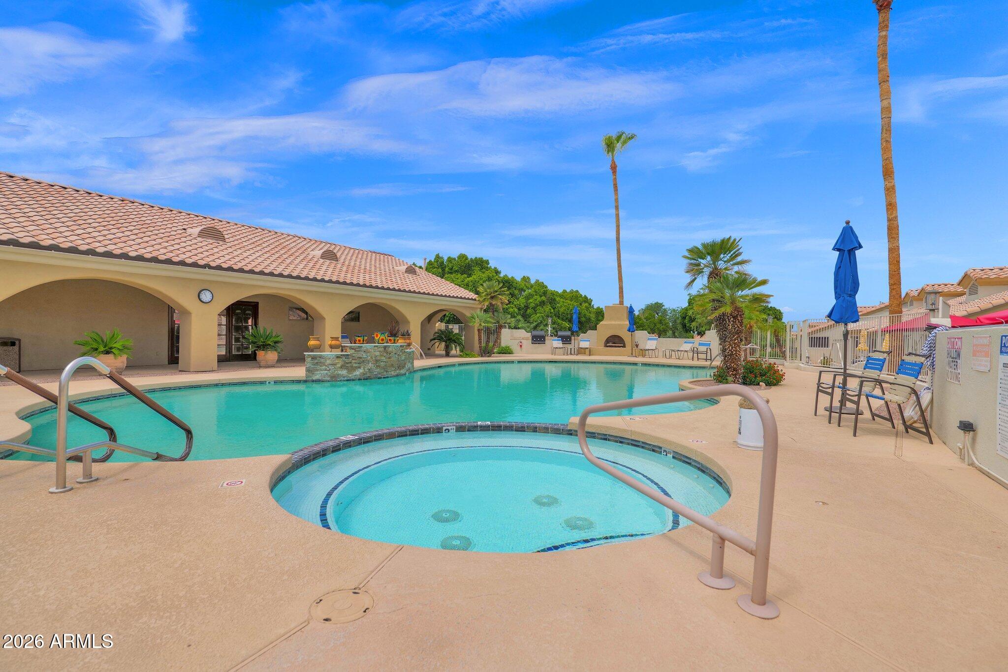 5830 East McKellips Road, Unit 110 Mesa, AZ 85215 - Photo 40 of 45 a view of a swimming pool with a yard