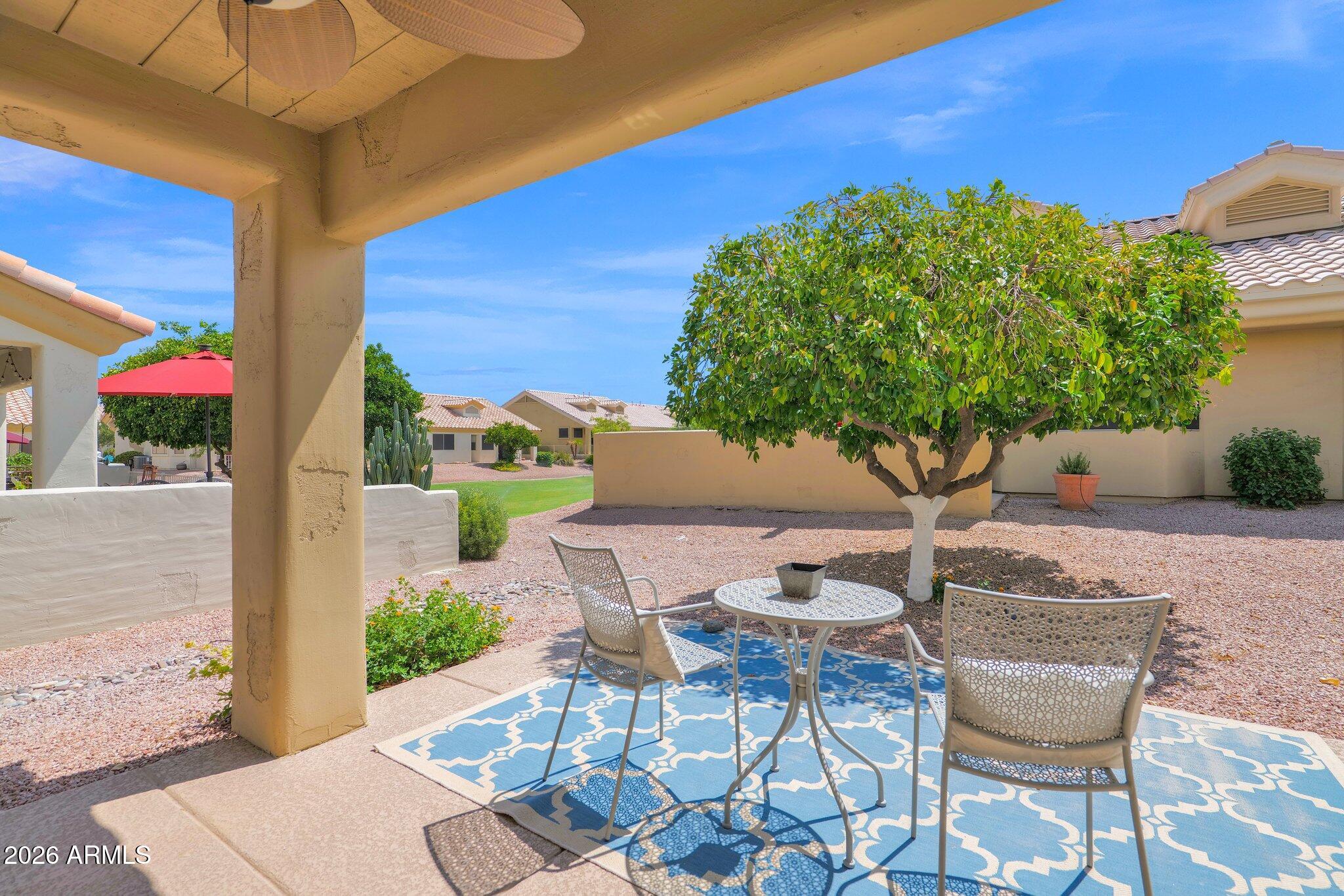 5830 East McKellips Road, Unit 110 Mesa, AZ 85215 - Photo 4 of 45 a view of an outdoor space with a table and chair
