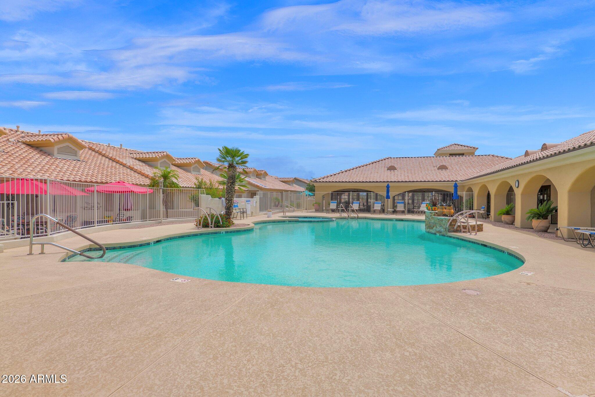 5830 East McKellips Road, Unit 110 Mesa, AZ 85215 - Photo 42 of 45 a front view of house with outdoor space and swimming pool