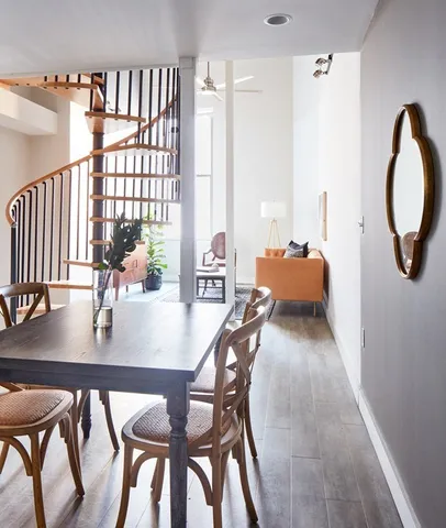 a dining room with furniture and window