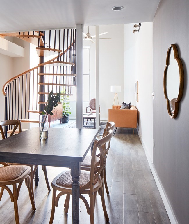 a dining room with furniture and window