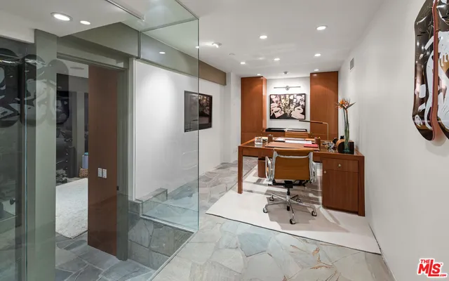 a bedroom with a bed and a table