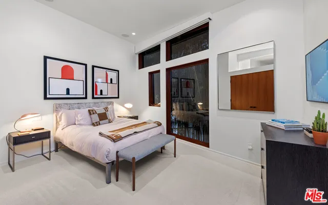 a view of an house with backyard space and balcony