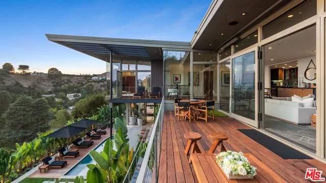 a view of swimming pool with seating space