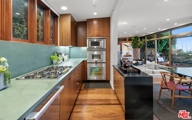 a bed room with a bed and a flat screen tv