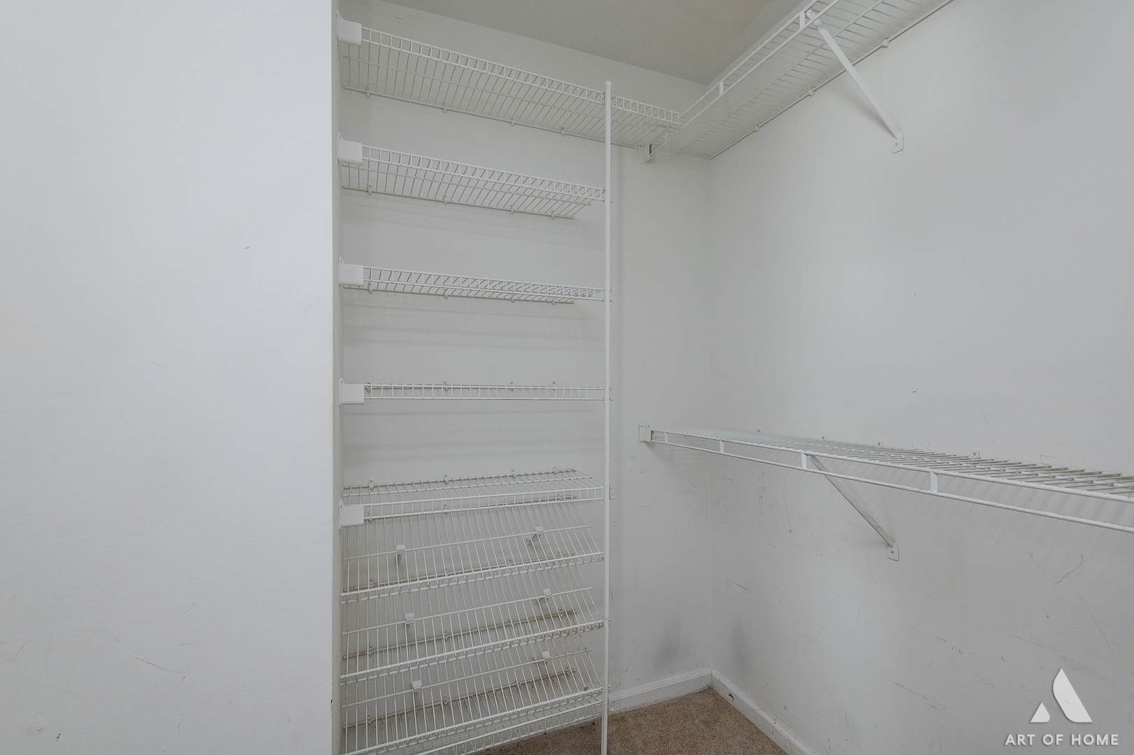 61 Willow Parkway Buffalo Grove, IL 60089 - Photo 22 of 34 a view of walk in closet with empty racks
