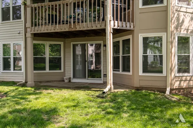 a view of a house with yard and sitting area