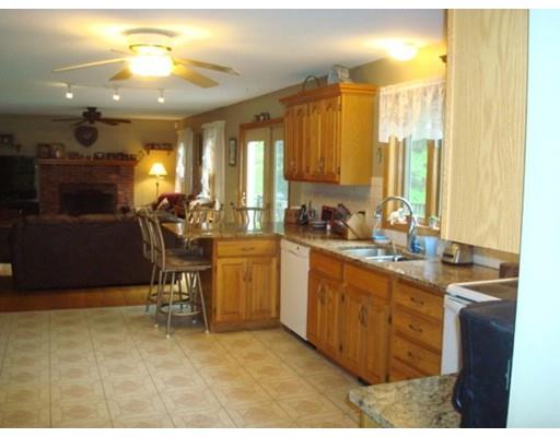 8 Old County Road Southampton, MA 01073 - Photo 8 of 23 a view of a kitchen with a sink stainless steel appliances cabinets and furniture