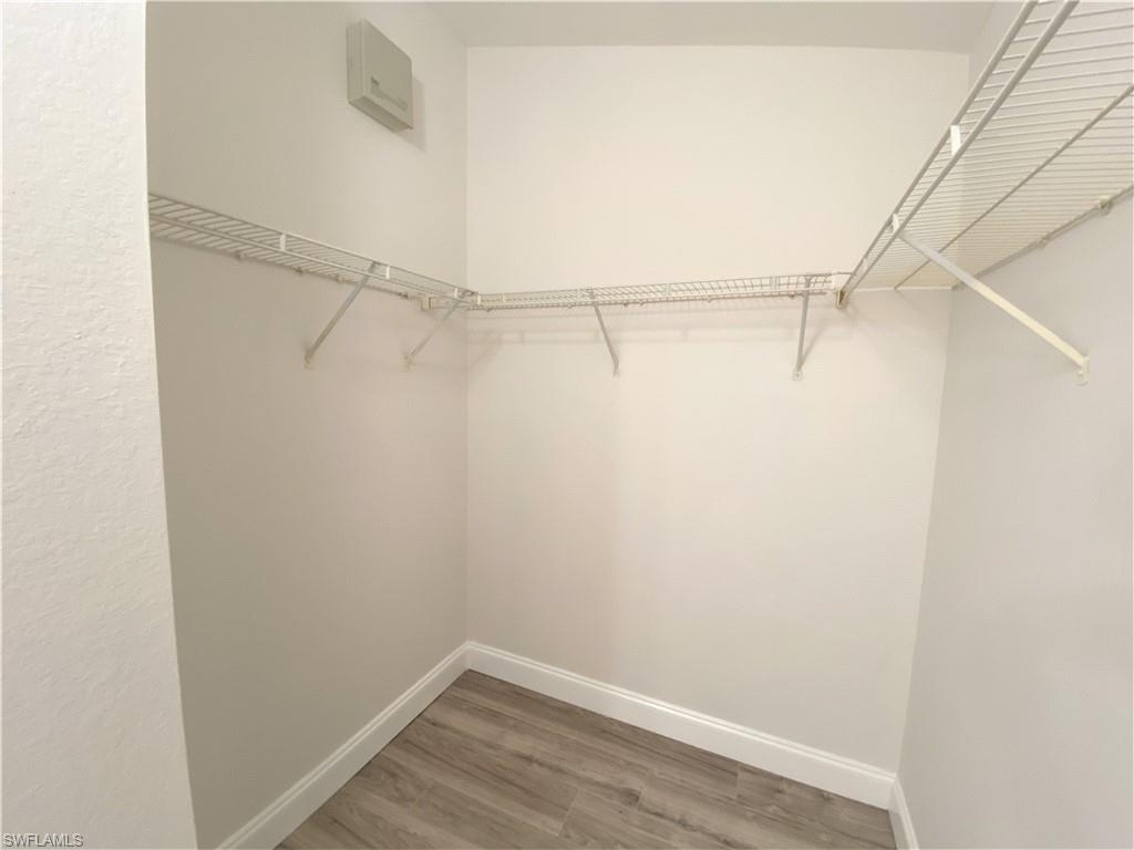 7965 Preserve Circle, Unit 734 Naples, FL 34119 - Photo 12 of 20 a view of a room with racks on the wall