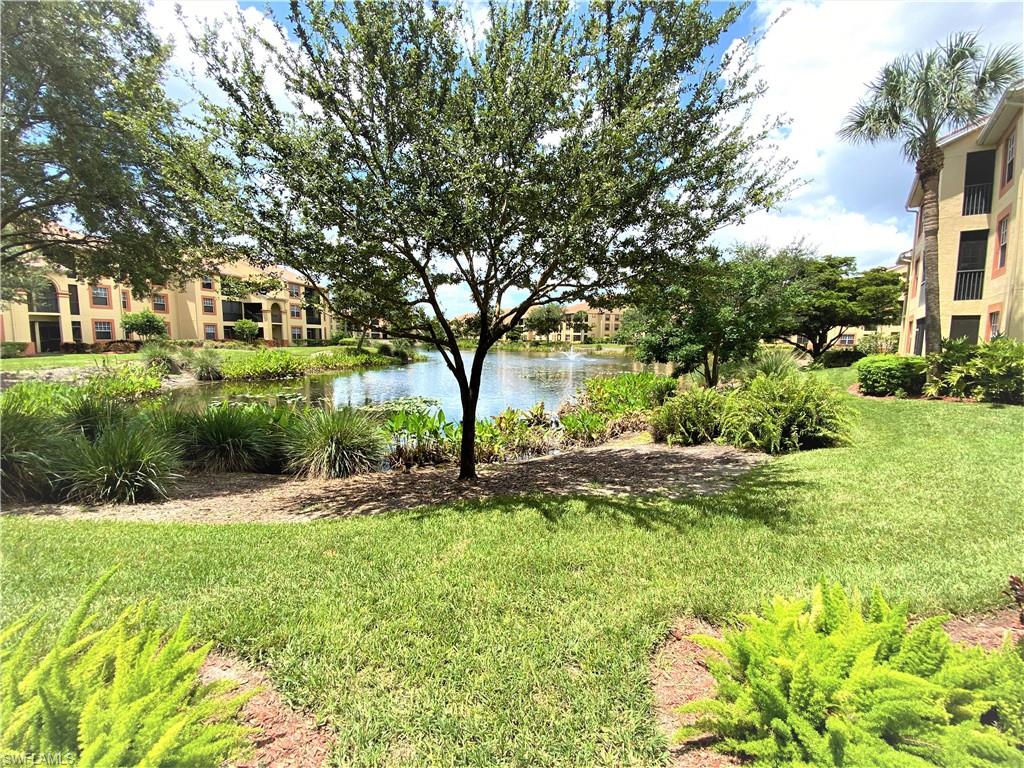 7965 Preserve Circle, Unit 734 Naples, FL 34119 - Photo 20 of 20 a front view of a house with a yard
