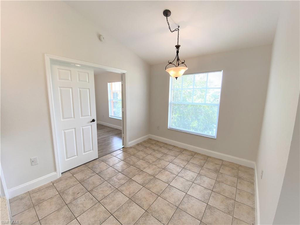 7965 Preserve Circle, Unit 734 Naples, FL 34119 - Photo 9 of 20 an empty room with windows and entrance