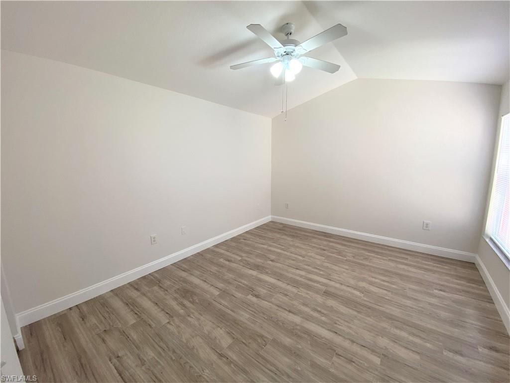 7965 Preserve Circle, Unit 734 Naples, FL 34119 - Photo 10 of 20 wooden floor in an empty room