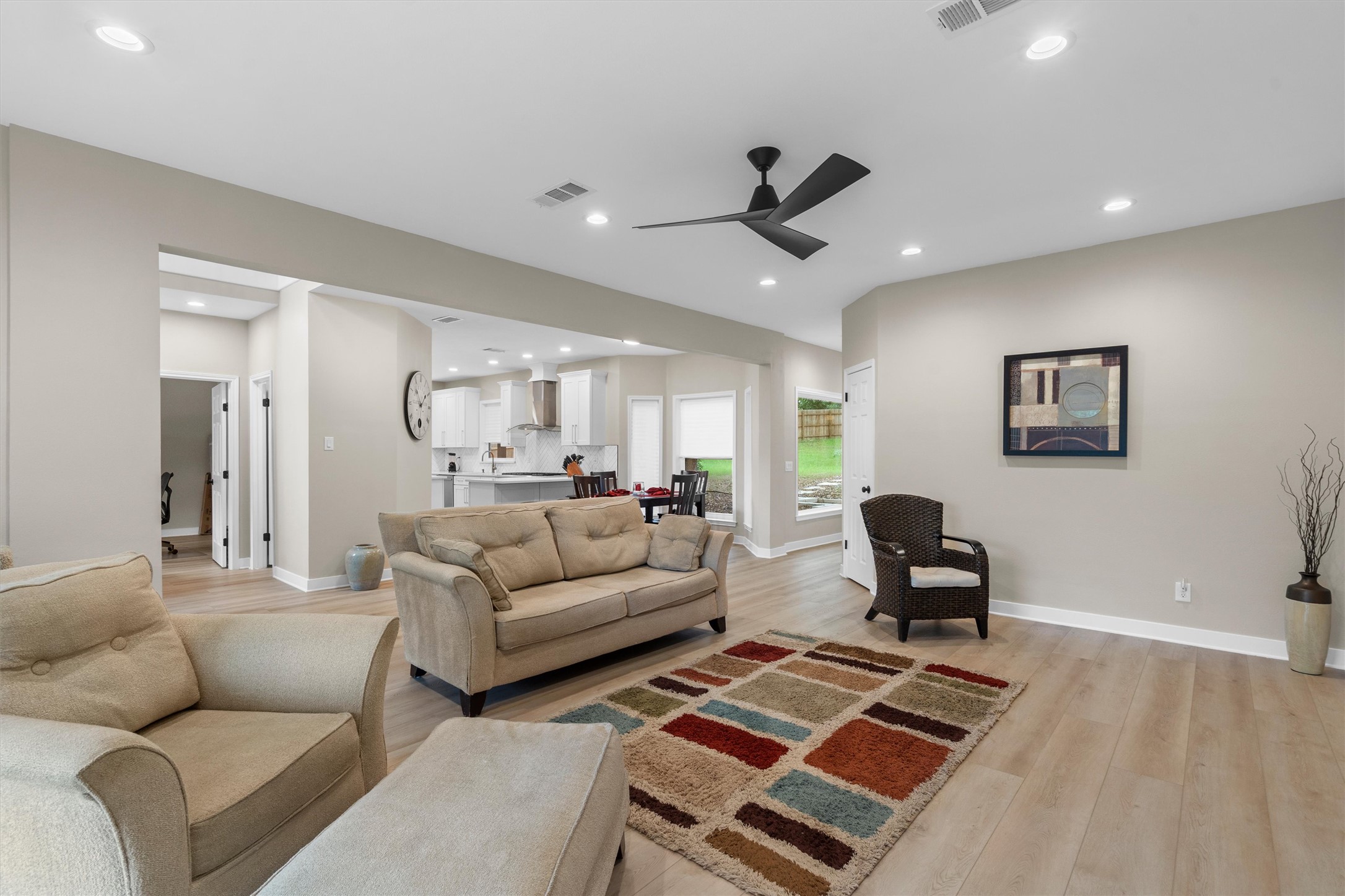 307 Hurst Creek Road Austin, TX 78734 - Photo 6 of 40 Spacious living area featuring light wood-finish flooring, recessed lighting, and a contemporary ceiling fan