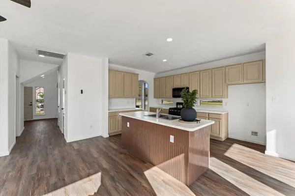 a kitchen with a sink and cabinets