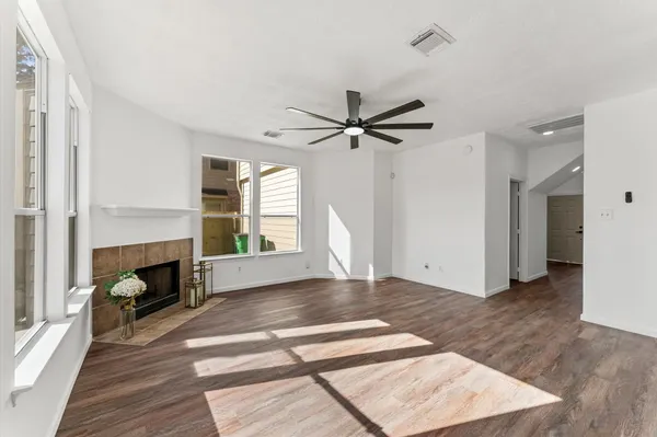a view of livingroom with hardwood floor and a fireplace