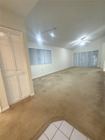 a swimming pool with outdoor seating and yard