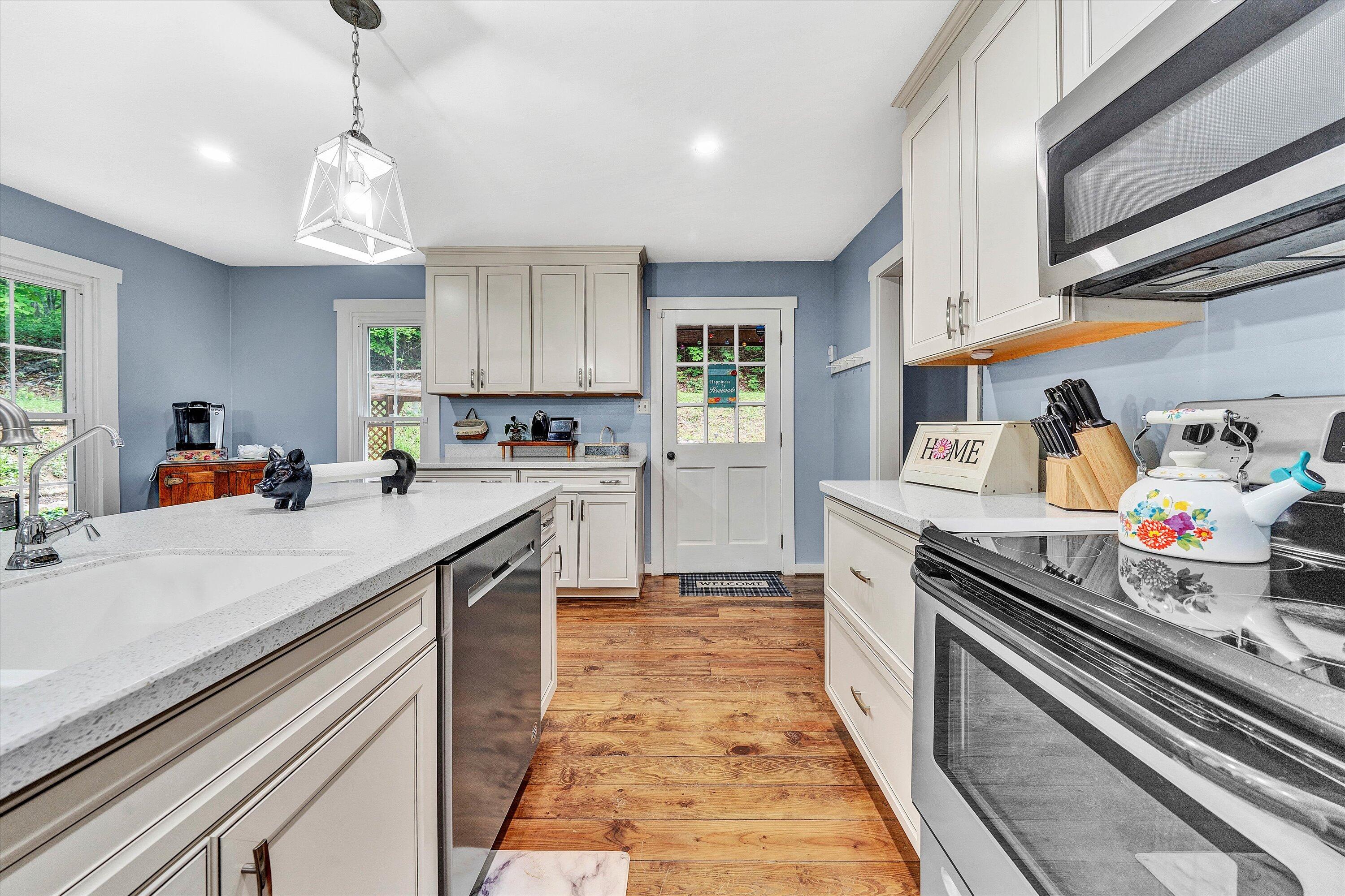 2270 Pico Road Buchanan, VA 24066 - Photo 2 of 47 a kitchen with stainless steel appliances granite countertop a sink stove and cabinets