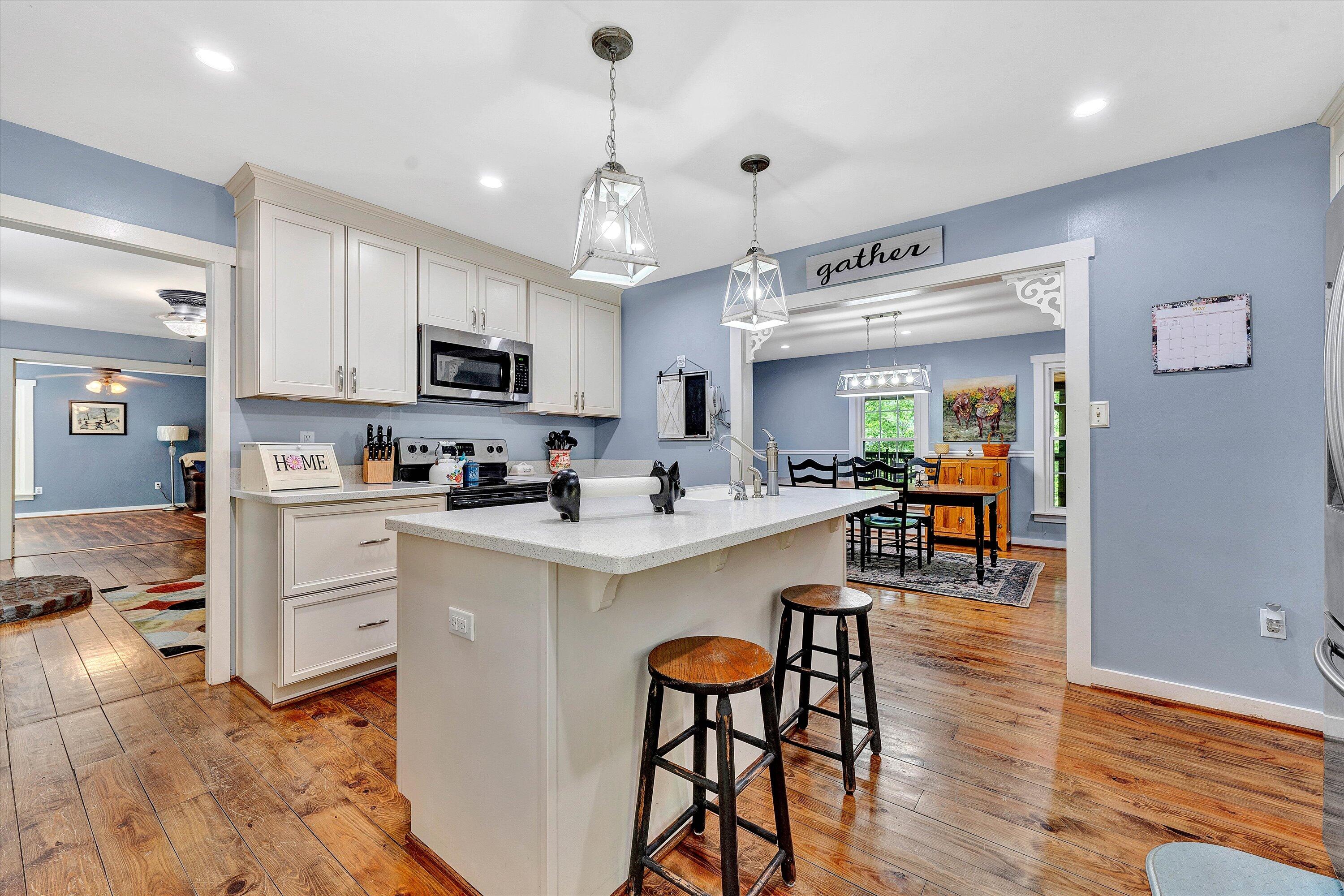 2270 Pico Road Buchanan, VA 24066 - Photo 26 of 47 a kitchen with white cabinets and stainless steel appliances
