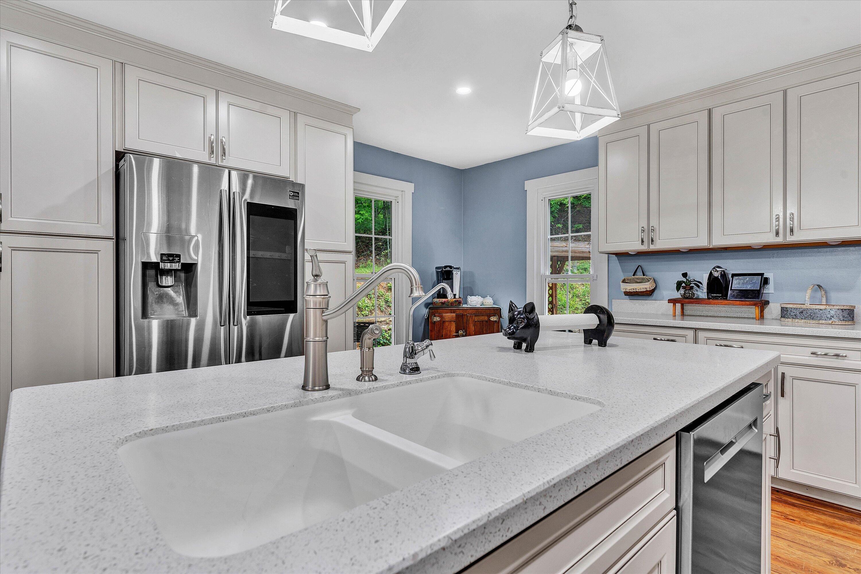 2270 Pico Road Buchanan, VA 24066 - Photo 29 of 47 a kitchen with stainless steel appliances granite countertop a sink refrigerator and cabinets