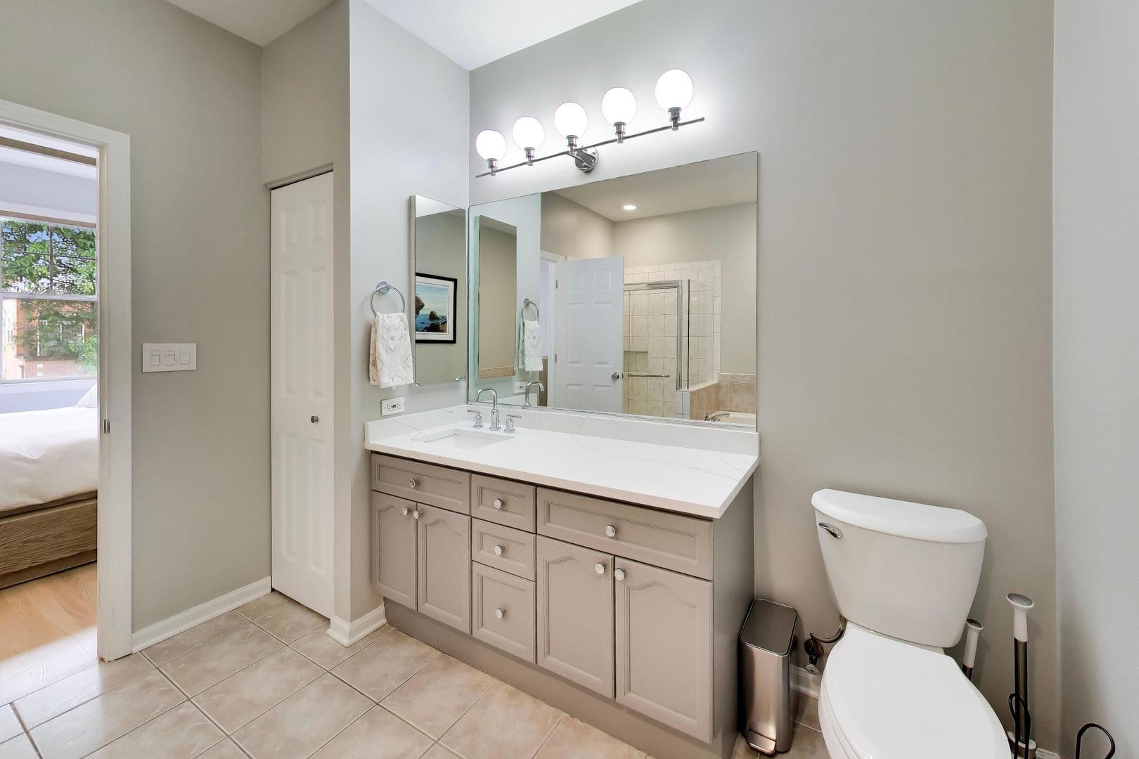 232 West Scott Street Chicago, IL 60610 - Photo 16 of 39 a bathroom with a toilet a sink and mirror