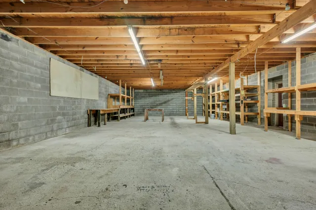 a view of a room with wooden ceiling