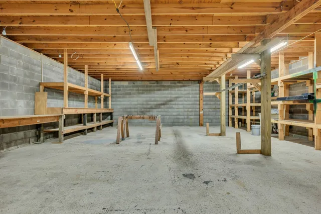 a view of a big room with wooden walls