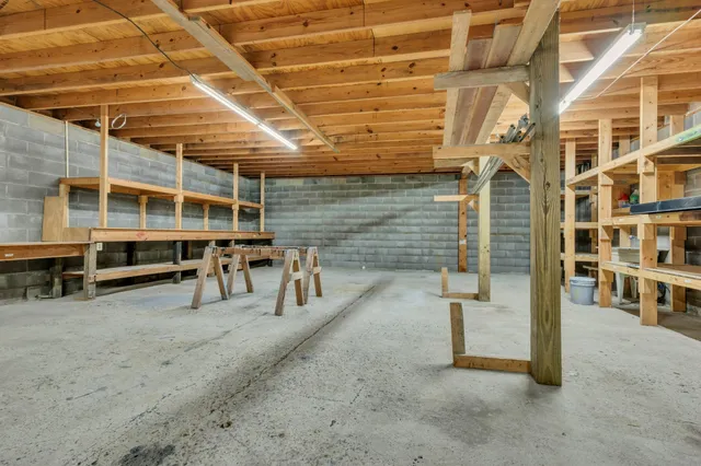 a view of a porch with a table and chairs