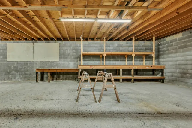 a view of a chairs and table in the room