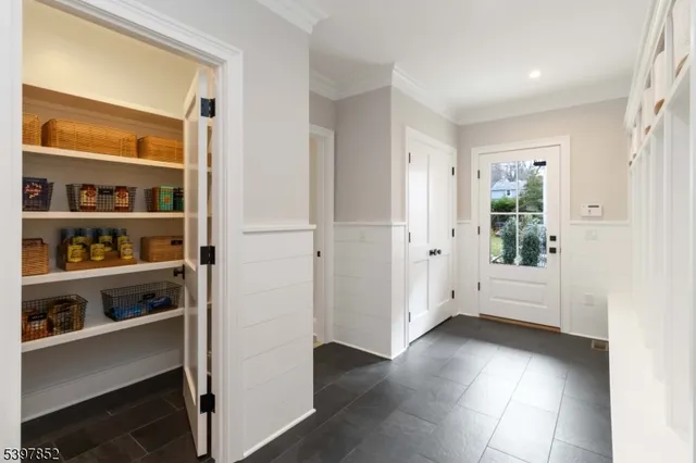 a bathroom with a toilet sink a mirror and shower