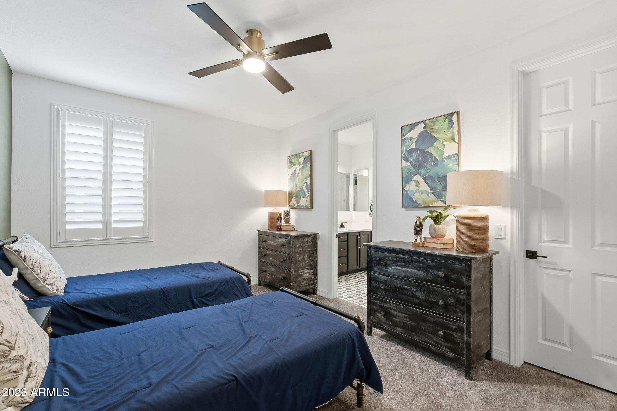 22607 East Russet Road Queen Creek, AZ 85142 - Photo 38 of 64 a bedroom with a bed and wooden floor