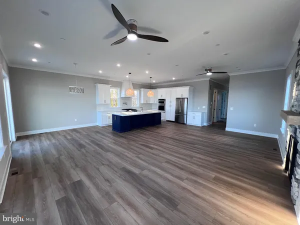 a kitchen with center island table and chairs in it