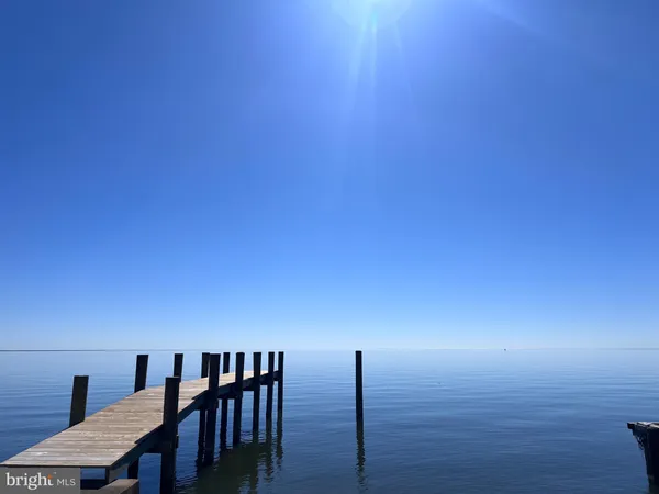 a bathroom with a double vanity sink and mirror