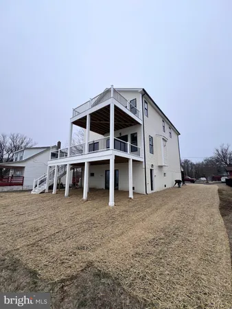 a spacious bedroom with a large bed and a window