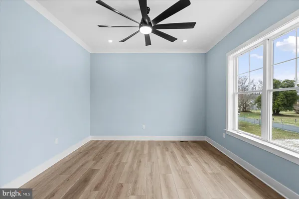 a view of a balcony with wooden floor
