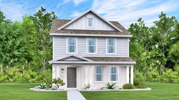 a front view of a house with a yard garage and outdoor seating