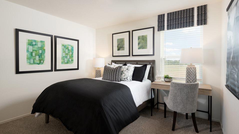 158 Meuse Lane Kyle, TX 78640 - Photo 13 of 13 a bedroom with a bed lamps and window