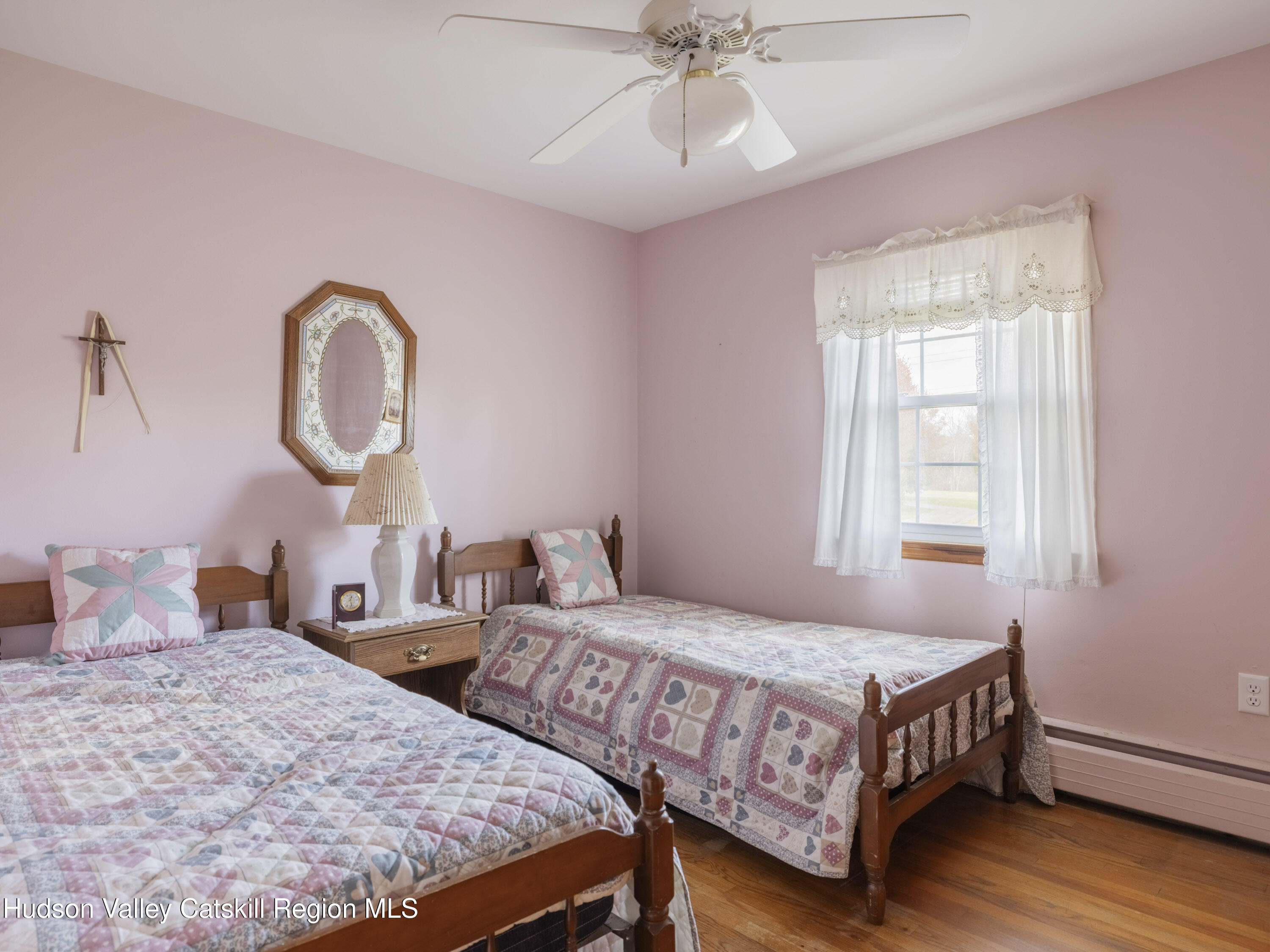 252 Highway 199 Red Hook, NY 12571 - Photo 15 of 45 a bedroom with two beds and a chandelier