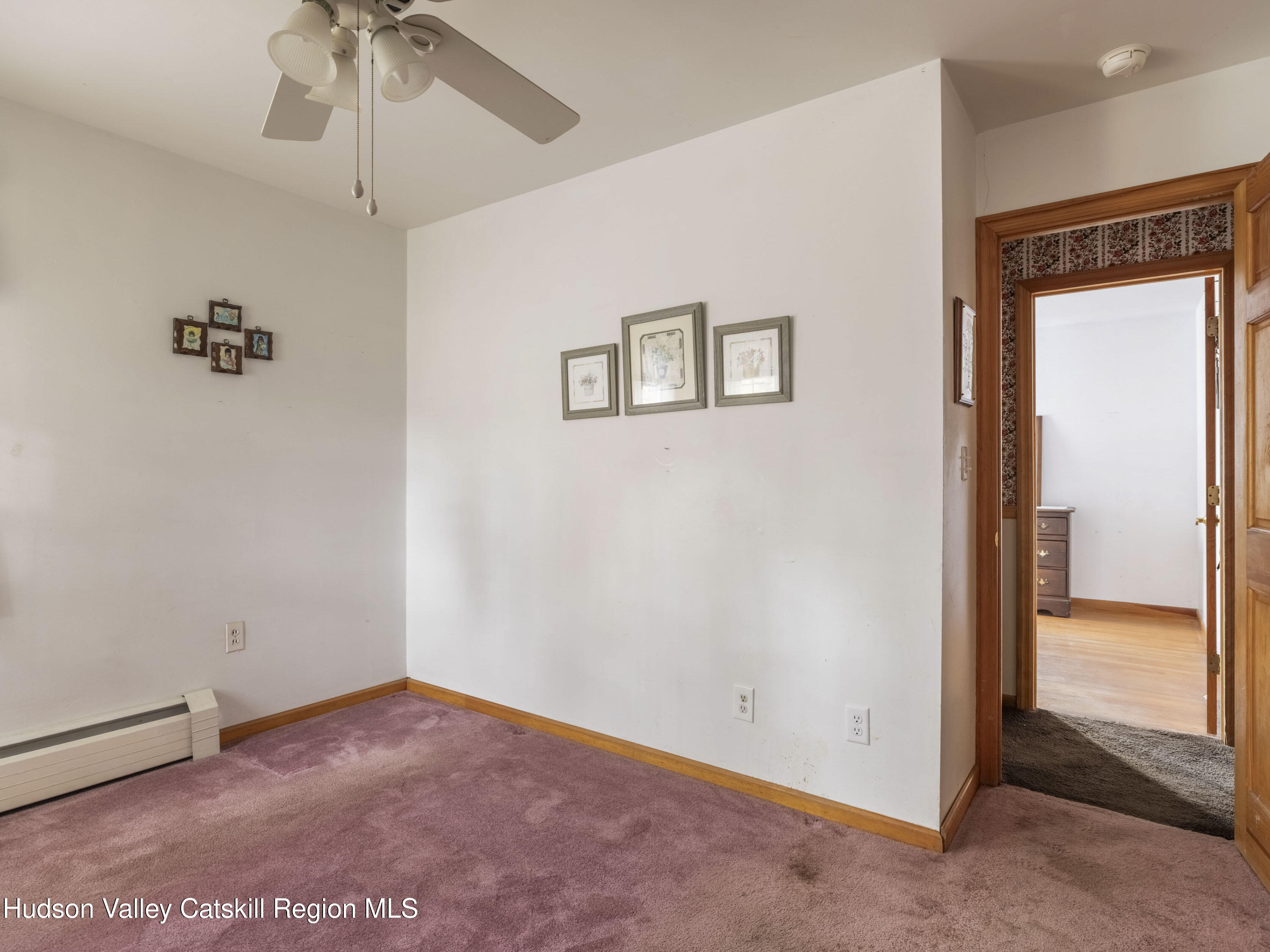 252 Highway 199 Red Hook, NY 12571 - Photo 20 of 45 an empty room with a ceiling fan and painted walls