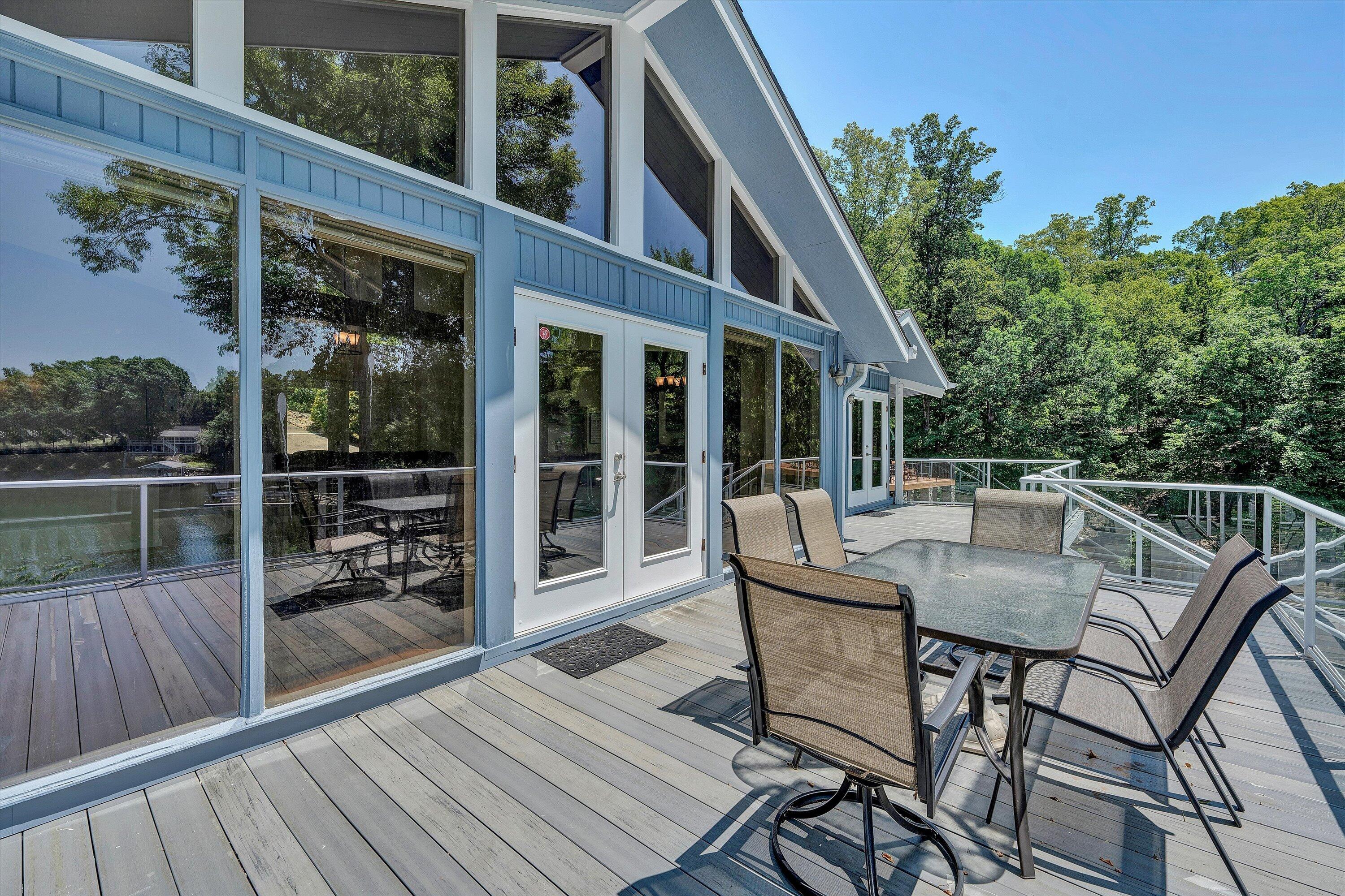 207 Winding Way Union Hall, VA 24176 - Photo 19 of 60 a view of a roof deck with table and chairs and wooden floor