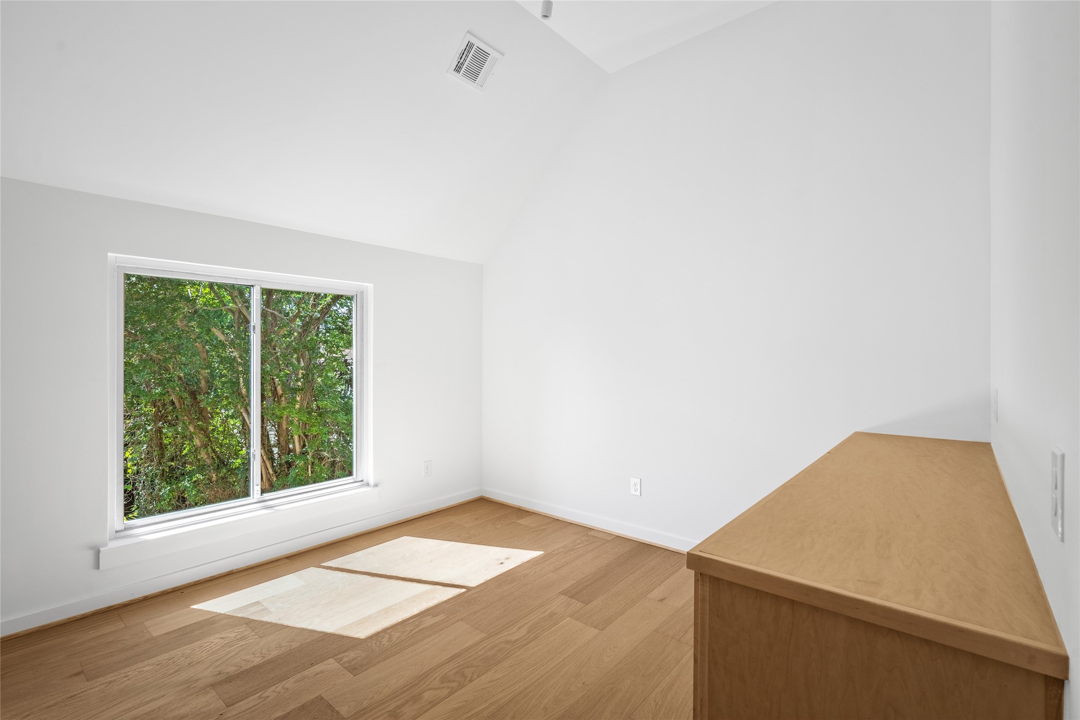 4429 Woodside Street, Unit B Houston, TX 77023 - Photo 17 of 17 a view of empty room with wooden floor and fan