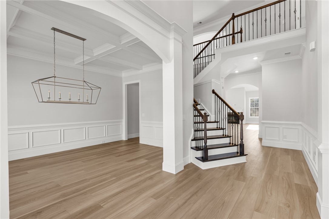 141 Rickys Path Easley, SC 29642 - Photo 3 of 40 Elegant entrance foyer with sweeping staircase and formal dining area.