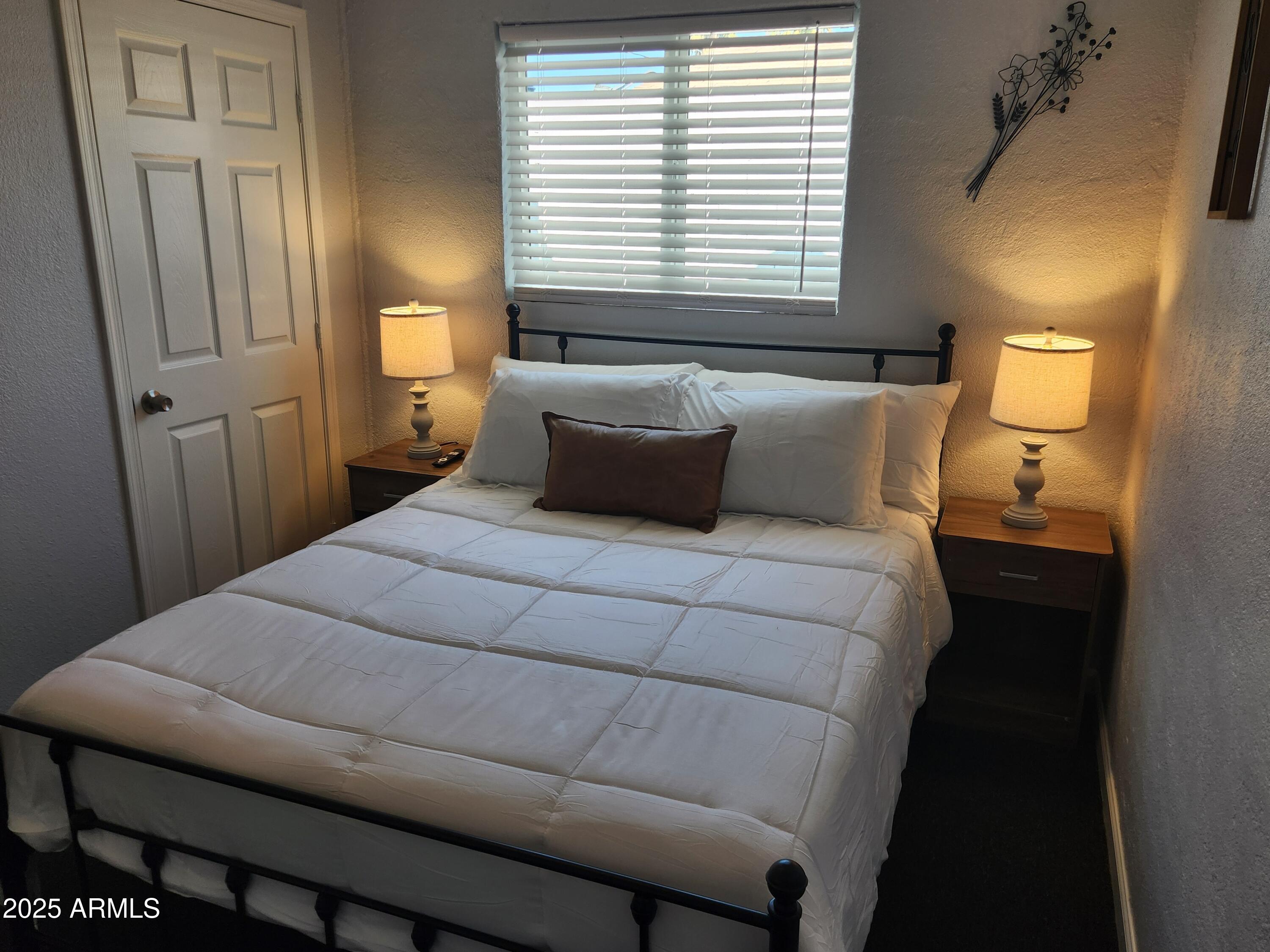 299 South Oregon Street, Unit 4 Chandler, AZ 85225 - Photo 24 of 39 a bedroom with a bed and window