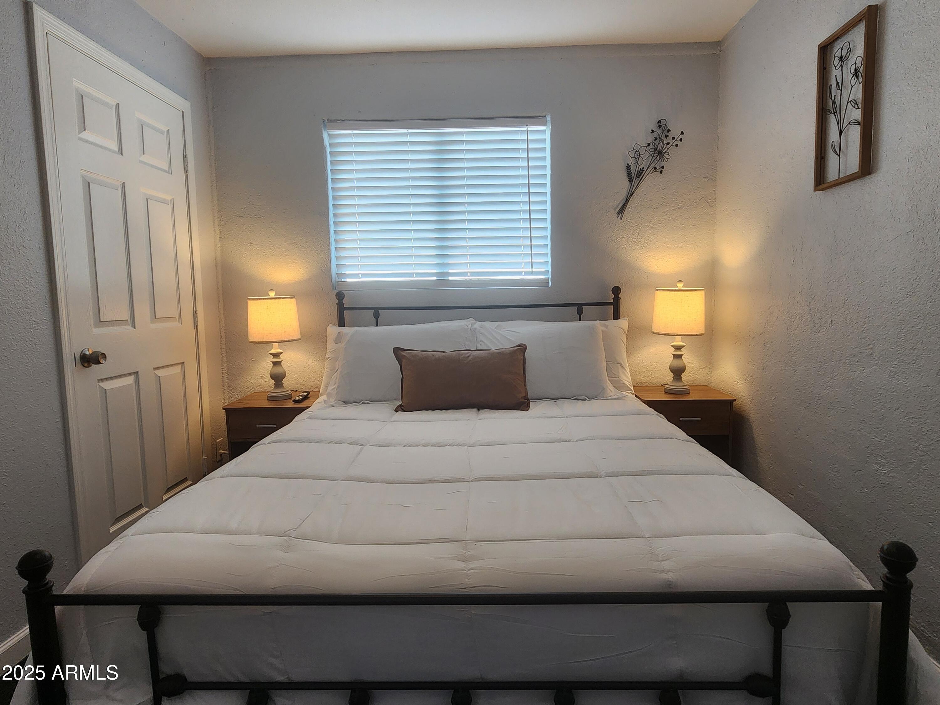 299 South Oregon Street, Unit 4 Chandler, AZ 85225 - Photo 25 of 39 a bedroom with a bed and window