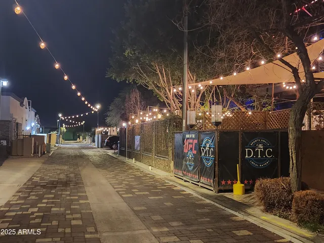 a view of a street with stores